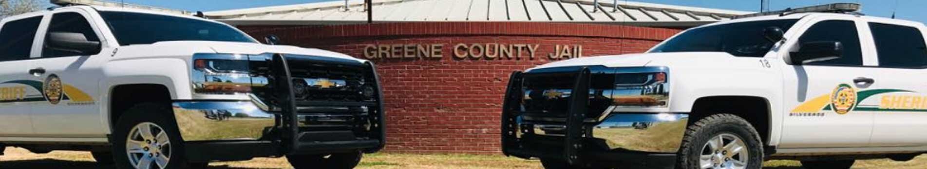 Greene County Police trucks in front of the Greene County Jail.
